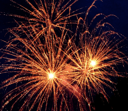 Golden fireworks in the night sky.